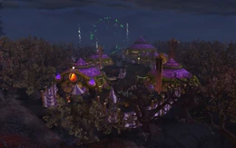 Colorful carnival tents and whimsical attractions at the Darkmoon Faire in World of Warcraft, set against a fantastical, moonlit landscape